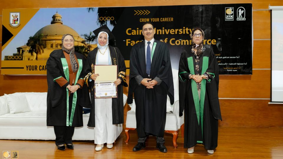 Shiren Ali receiving her postgraduate certificate with Cairo University faculty members